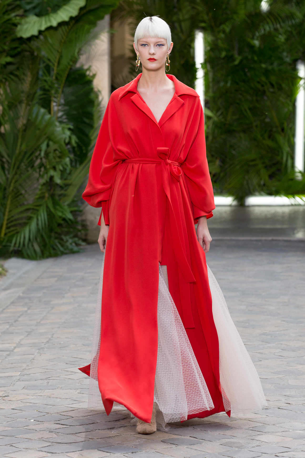 Model in a flowing red runway look