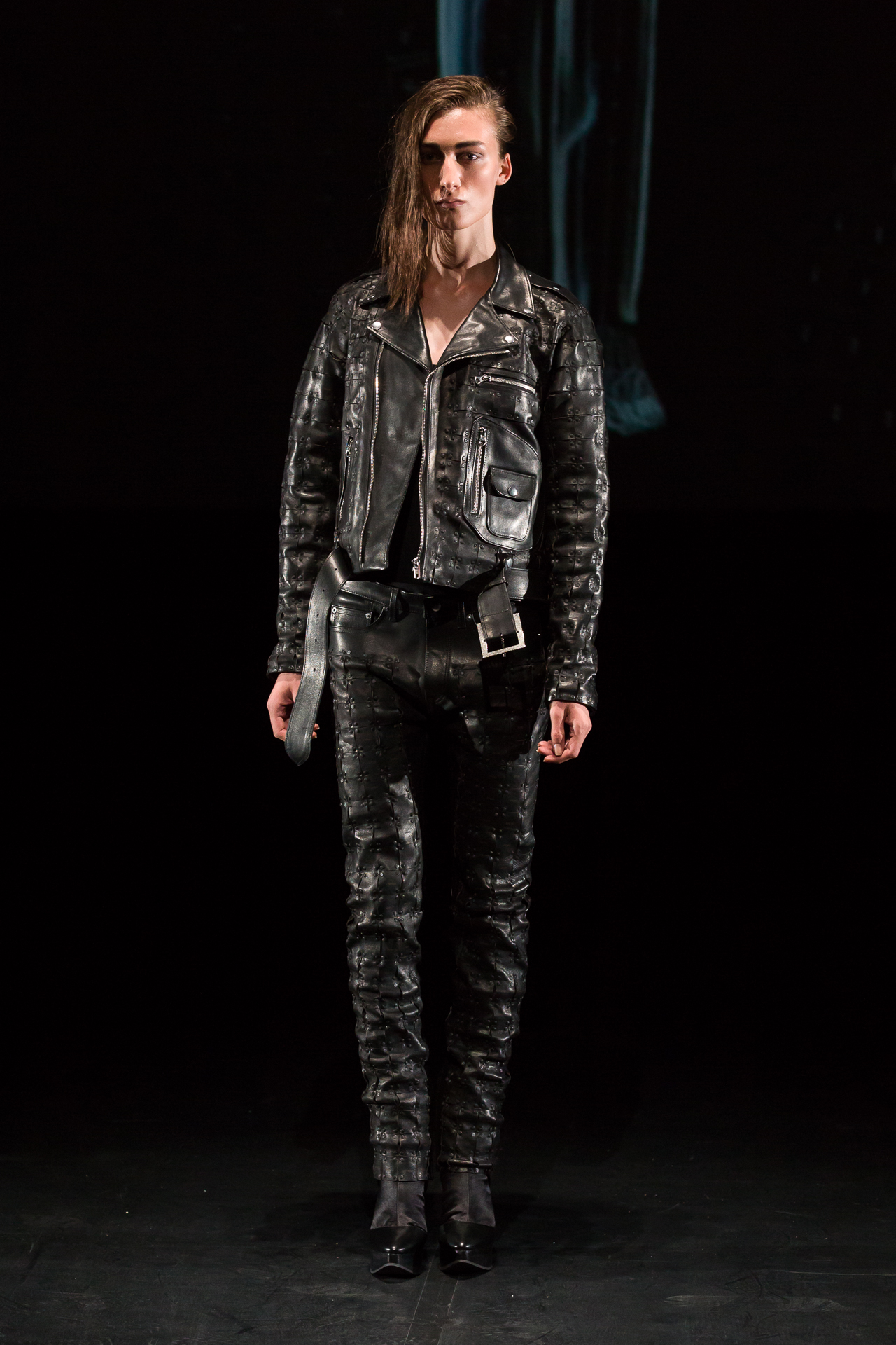 Model in an all-black leather runway look